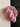 a skein of hand dyed pink yarn laid on top of more yarn